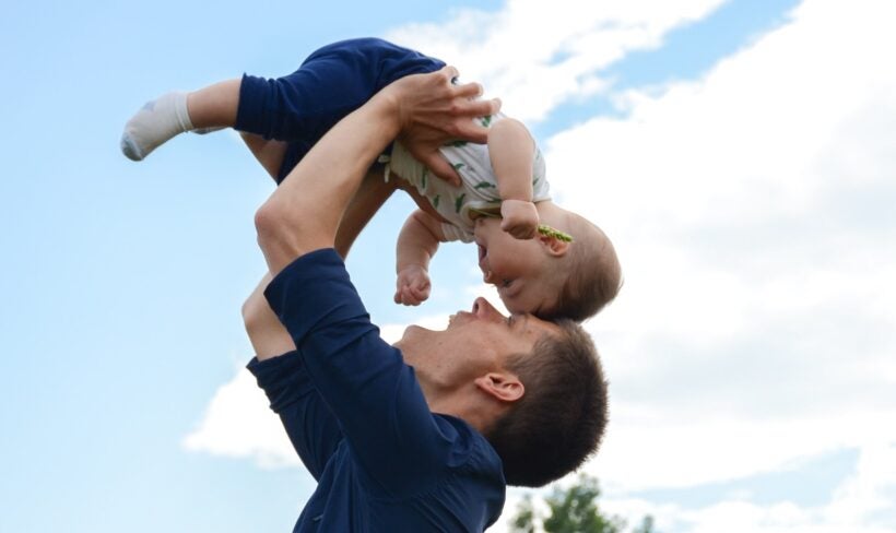 Dad Holding Baby Up High