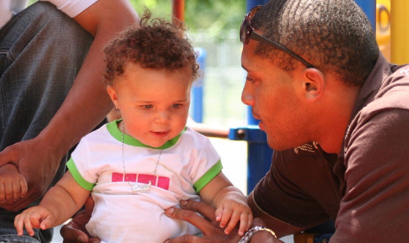 A father having a intimate conversation with his toddler