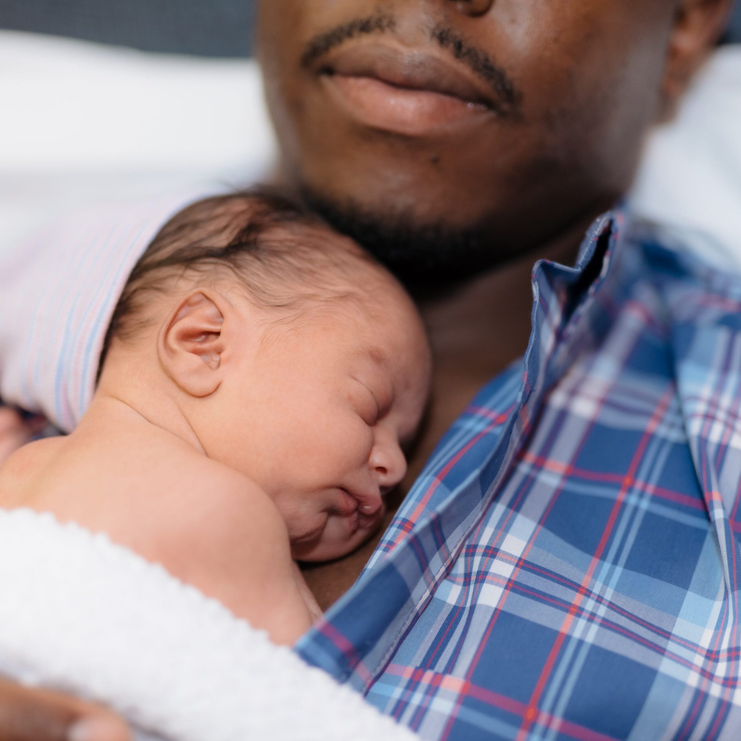 Father With Baby On Chest