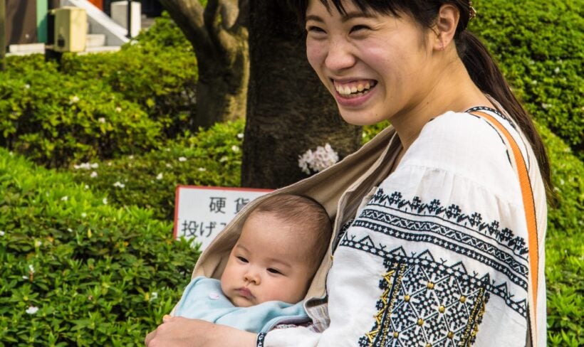 Mom Carrying Infant In Robe