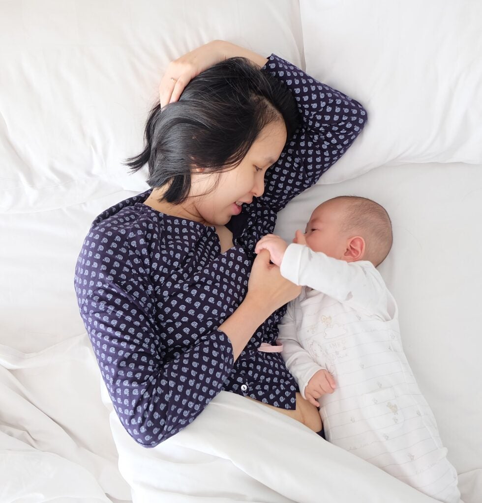 Mom In Bed With Infant