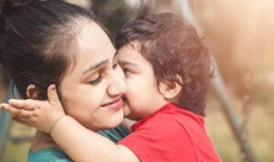 An Indian mother and her baby hugging